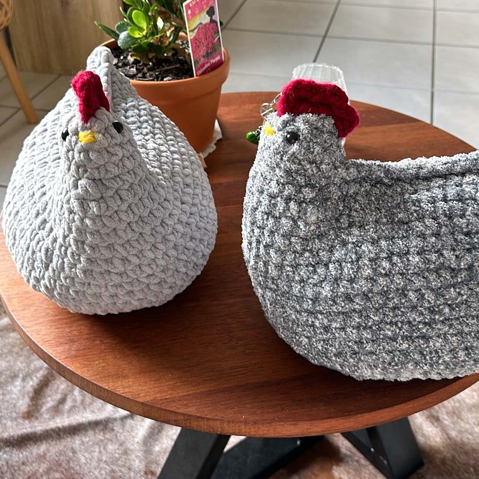 Two grey crochet chickens